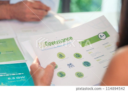 close up diversity team brainstorming focused on ESG (environment,social,governance) for sdgs goals in a sustainable green office close up diversity team brainstorming focused on ESG (environment,social,governance) for sdgs goals in a sustainable green office 114894542