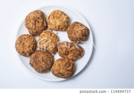 Indian famous tea snacks ooty varkey pastry on white plate on a white background. 114894737