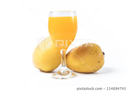 Mango juice in a glass isolated on white background. Fresh fruit. 114894743