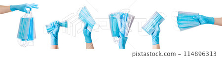 Doctor's hand in medical gloves holding a pile of masks isolated on white Doctor's hand in medical gloves holding a pile of masks isolated on white 114896313