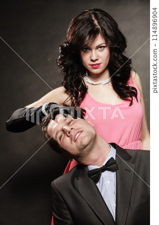 Woman in control of man Woman in control of man 114896904