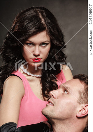 Woman in control of man Woman in control of man 114896907