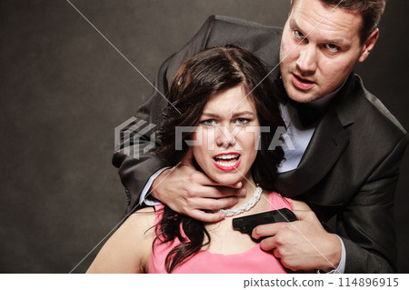 Scene of violence with firearm between men and women. 114896915