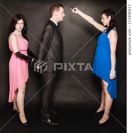 Scene of violence with firearm between men and women. Scene of violence with firearm between men and women. 114896917