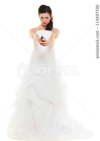 Angry bride with gun isolated on white. 114897586