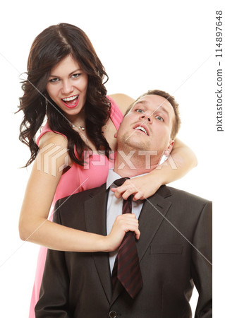 Woman pulling tie of man. Woman pulling tie of man. 114897648