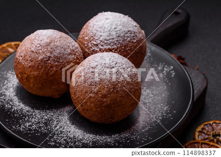 Round homemade cheese donuts glazed with citrus flavor Round homemade cheese donuts glazed with citrus flavor 114898337