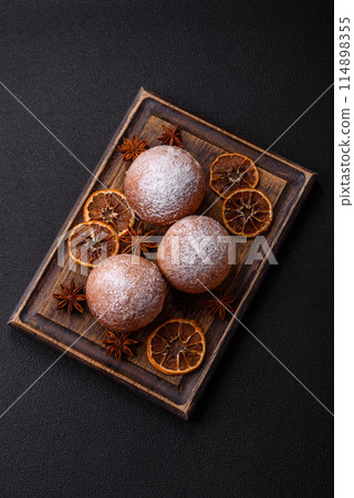 Round homemade cheese donuts glazed with citrus flavor 114898355