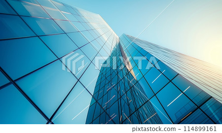 A vibrant skyscraper in simple shapes, bathed in serene blue light with reflections. 114899161