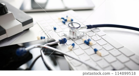Stethoscope and Pharmaceutical Pill Lying Keyboard Stethoscope and Pharmaceutical Pill Lying Keyboard 114899518