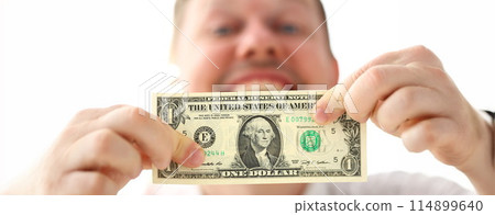 Male hands holding one us dollar banknote making some point about business success 114899640