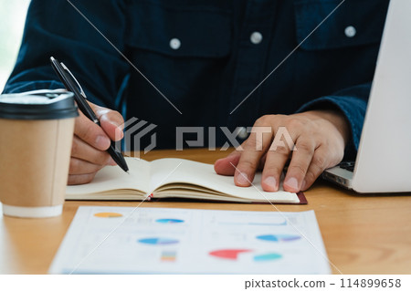 Men's hand looking at materials Men's hand looking at materials 114899658