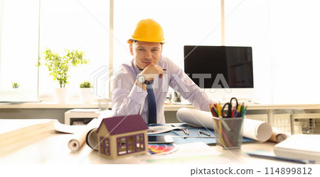 Young Architect Design Building Plan at Office 114899812