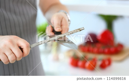 Chef Male Sharpening Stainless Knife Photography 114899816
