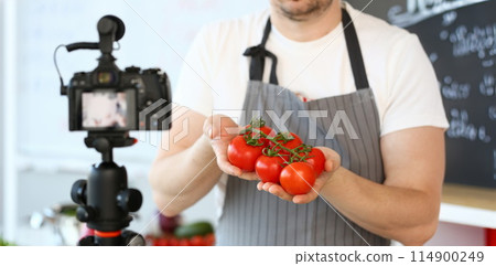 Vlogger Chef Showing Ripe Tomatoes Ingredient 114900249