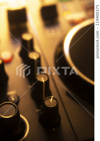 Dj turntables in nightclub 114900375