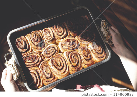 Cinnamon bun roll in plate. Homemade Oven bakery desert for breakfast Cinnamon bun roll in plate. Homemade Oven bakery desert for breakfast 114900982