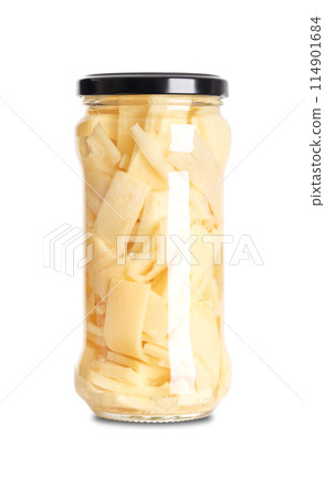Pickled bamboo shoot slices in a glass jar with screw cap. Thin sliced bamboo shoot, pasteurized and preserved in vinegar brine and salt. Used in Thai cuisine for soup, stir-fries and salads. Photo 114901684