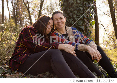 two young women in nature, in the forest 114902172