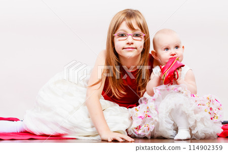 Two little sisters portrait. 114902359