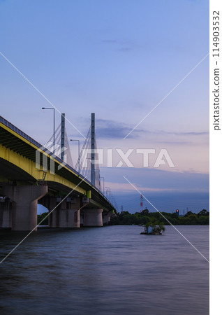 A spectacular view of the sunset and Kokonohashi Bridge in Toda City, Saitama Prefecture 114903532