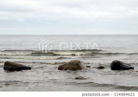 Granite stones on shore of Lake Ladoga. 114904022