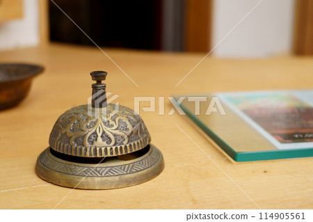A bell on a table A bell on a table 114905561