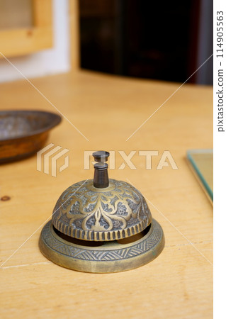 A bell on a table A bell on a table 114905563