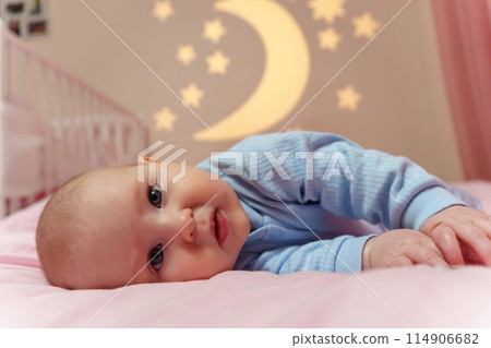 Dream Baby Nestled Among Moon and Stars in Bed, going to sleep. 114906682