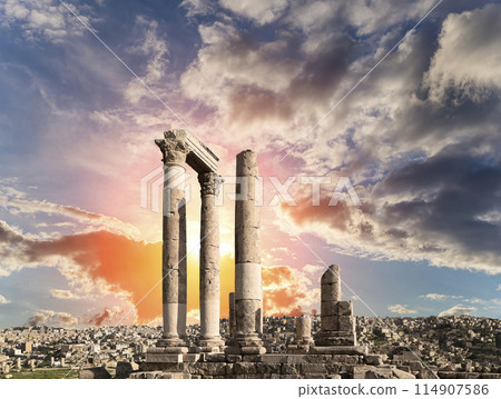 Amman city landmarks-- old roman Citadel Hill, Jordan. Against the background of a beautiful sky with clouds Amman city landmarks-- old roman Citadel Hill, Jordan. Against the background of a beautiful sky with clouds 114907586