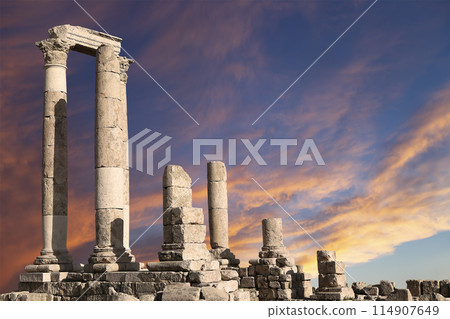 Amman city landmarks-- old roman Citadel Hill, Jordan. Against the background of a beautiful sky with clouds Amman city landmarks-- old roman Citadel Hill, Jordan. Against the background of a beautiful sky with clouds 114907649