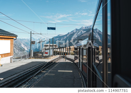View from train running to station among Swiss Alps at Switzerland 114907781