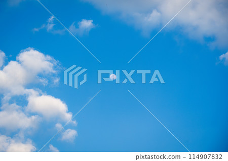 Moon with clouds in blue sky 114907832