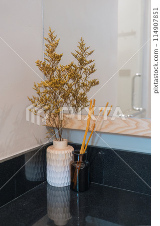 Aroma perfume sticks in bottle with dry flower in vase decorative Aroma perfume sticks in bottle with dry flower in vase decorative 114907851