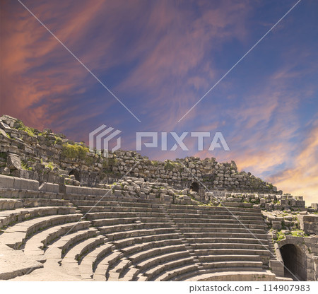 West Theatre of Umm Qais (Umm Qays)--is a town in northern Jordan near the site of the ancient town of Gadara, Jordan. Against the background of a beautiful sky with clouds West Theatre of Umm Qais (Umm Qays)--is a town in northern Jordan near the site of the ancient town of Gadara, Jordan. Against the background of a beautiful sky with clouds 114907983