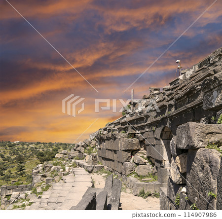 West Theatre of Umm Qais (Umm Qays)--is a town in northern Jordan near the site of the ancient town of Gadara, Jordan. Against the background of a beautiful sky with clouds 114907986