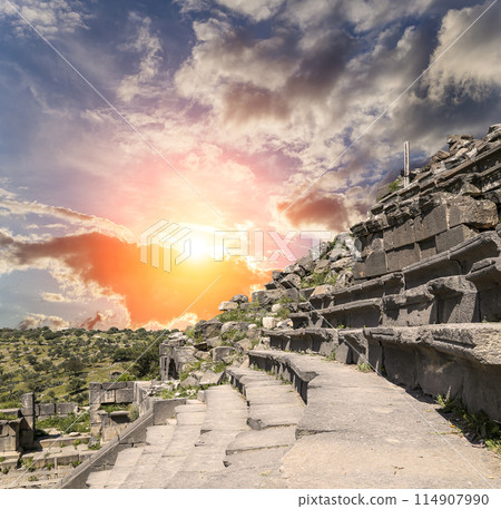 West Theatre of Umm Qais (Umm Qays)--is a town in northern Jordan near the site of the ancient town of Gadara, Jordan. Against the background of a beautiful sky with clouds 114907990