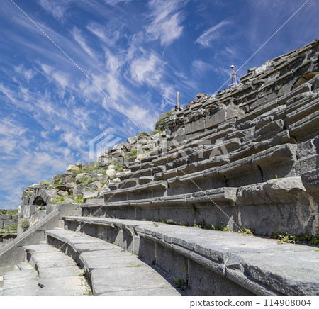 West Theatre of Umm Qais (Umm Qays)--is a town in northern Jordan near the site of the ancient town of Gadara, Jordan. Against the background of a beautiful sky with clouds 114908004
