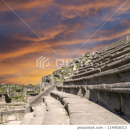 West Theatre of Umm Qais (Umm Qays)--is a town in northern Jordan near the site of the ancient town of Gadara, Jordan. Against the background of a beautiful sky with clouds 114908013