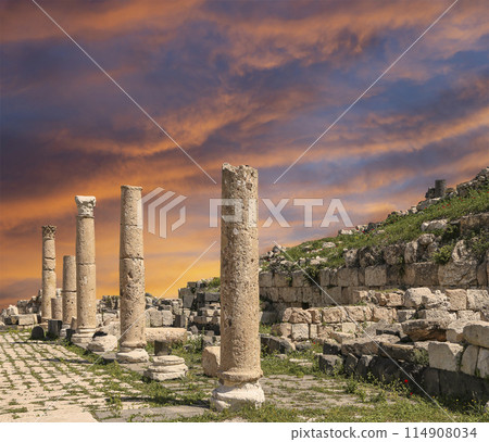 Roman ruins at Umm Qais (Umm Qays)--is a town in northern Jordan near the site of the ancient town of Gadara, Jordan. Against the background of a beautiful sky with clouds 114908034
