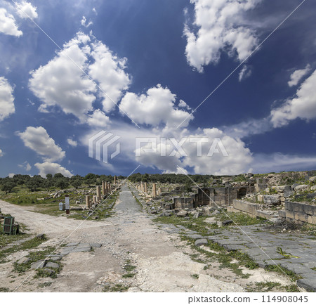 Roman ruins at Umm Qais (Umm Qays)--is a town in northern Jordan near the site of the ancient town of Gadara, Jordan. Against the background of a beautiful sky with clouds 114908045