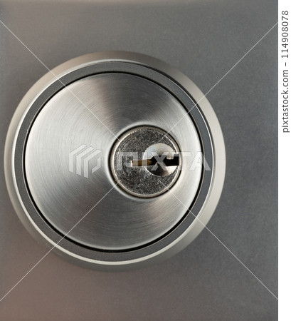 Shiny metal keyhole 114908078