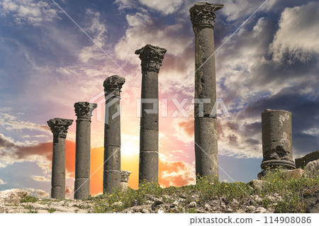 Roman ruins at Umm Qais (Umm Qays)--is a town in northern Jordan near the site of the ancient town of Gadara, Jordan. Against the background of a beautiful sky with clouds 114908086