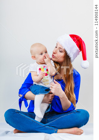 Christmas woman with cute baby. 114908144