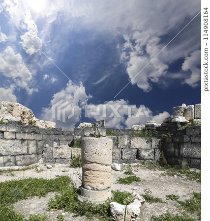 Roman ruins at Umm Qais (Umm Qays)--is a town in northern Jordan near the site of the ancient town of Gadara, Jordan. Against the background of a beautiful sky with clouds Roman ruins at Umm Qais (Umm Qays)--is a town in northern Jordan near the site of the ancient town of Gadara, Jordan. Against the background of a beautiful sky with clouds 114908164