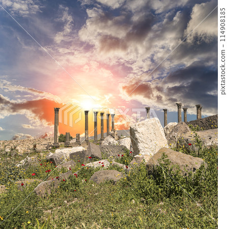 Roman ruins at Umm Qais (Umm Qays)--is a town in northern Jordan near the site of the ancient town of Gadara, Jordan. Against the background of a beautiful sky with clouds 114908185