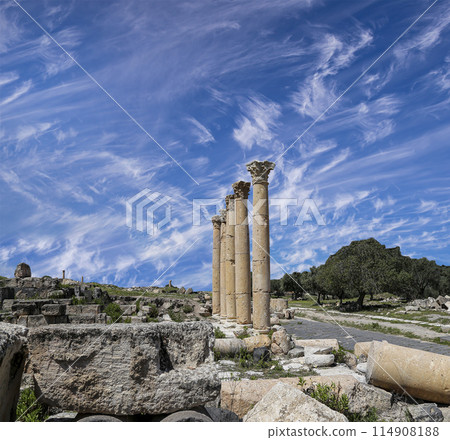 Roman ruins at Umm Qais (Umm Qays)--is a town in northern Jordan near the site of the ancient town of Gadara, Jordan. Against the background of a beautiful sky with clouds 114908188
