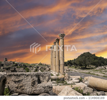 Roman ruins at Umm Qais (Umm Qays)--is a town in northern Jordan near the site of the ancient town of Gadara, Jordan. Against the background of a beautiful sky with clouds 114908189