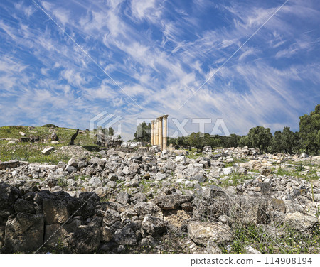 Roman ruins at Umm Qais (Umm Qays)--is a town in northern Jordan near the site of the ancient town of Gadara, Jordan. Against the background of a beautiful sky with clouds 114908194