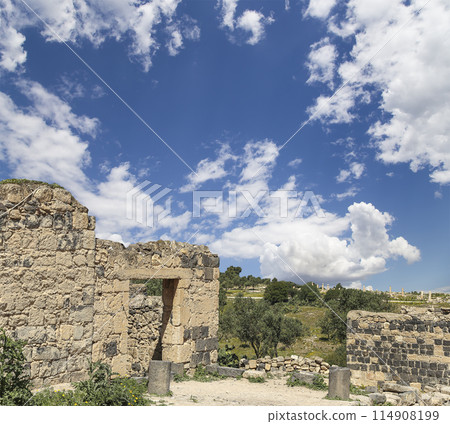 Roman ruins at Umm Qais (Umm Qays)--is a town in northern Jordan near the site of the ancient town of Gadara, Jordan. Against the background of a beautiful sky with clouds 114908199